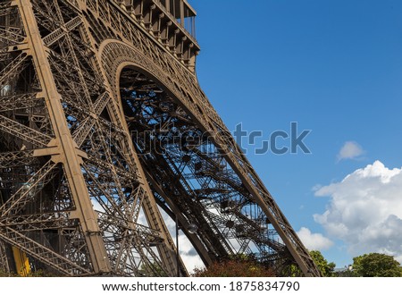 Similar – Eiffel Tower in green trees on blue sky