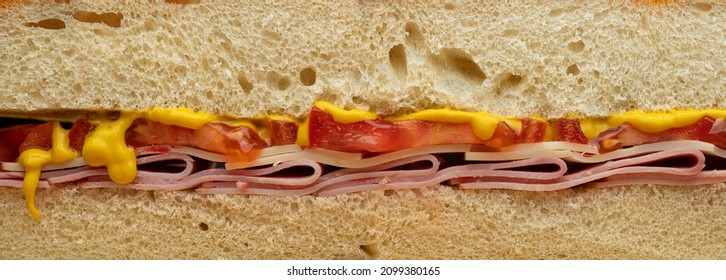 Cross Section Of A Ham And Cheese Sandwich. With, Tomatoes, Swiss Cheese, Ham And Mustard .