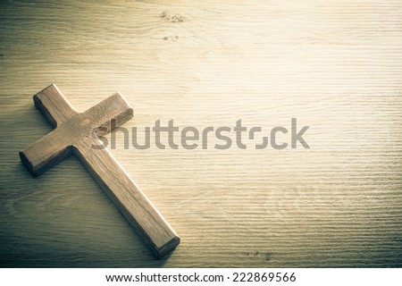 Cross shape on a wooden background. Large copy space available. / Cross background concept