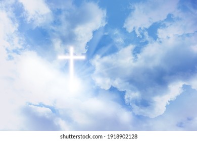 Cross silhouette in blue sky. Resurrection of Jesus - Shutterstock ID 1918902128