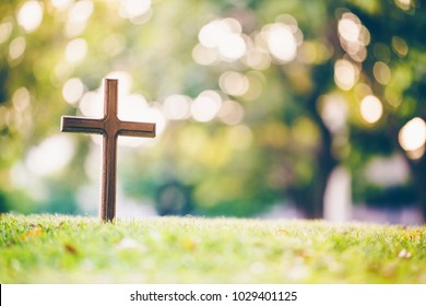 The cross standing on meadow sunset and bokeh background.Cross on a hill as the morning sun comes up for the day.The cross symbol for Jesus Christ. Christianity, religious, faith, Jesus or belief. - Shutterstock ID 1029401125