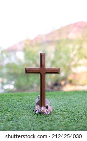 The cross standing on meadow sunset and bokeh background. Cross on a hill as the morning sun comes up for the day. The cross symbol for Jesus christ. Christianity, religious, faith, Jesus or belief. - Shutterstock ID 2124254030