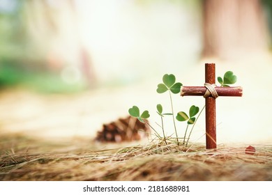 A cross symbolizing the death and resurrection of Jesus Christ, a heart-shaped leaf of grass and a beautiful bright background
 - Shutterstock ID 2181688981
