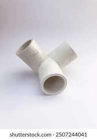 cross tee pipe fitting to divide water flow into three isolated on white background