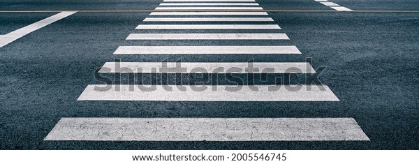 cross walk on the road for safety when people\
walking cross the street, Pedestrian crossing on repaired asphalt\
road, Crosswalk on the street for safety, logistic import export\
and transport industry