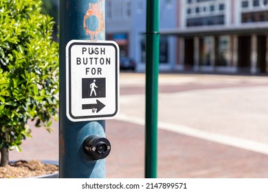 Cross Walk Sign And Button For Pedestrians To Cross A Downtown Intersection