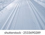 Cross-country skiing track on snow, made with a track machine