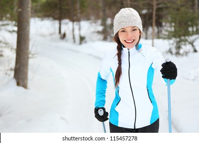 Cross-country Skiing Woman Doing Classic Nordic Cross Country Skiing In Trail Tracks In Snow Covered Forest In Quebec, Canada