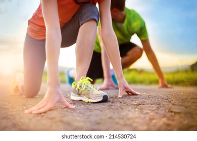 Cross-country Trail Running People At Sunset. Runner Couple Exercising Outside As Part Of Healthy Lifestyle.