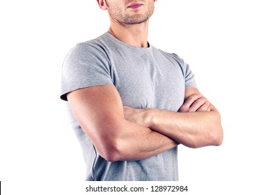 Crossed arms close up of muscular man on white background. - Powered by Shutterstock