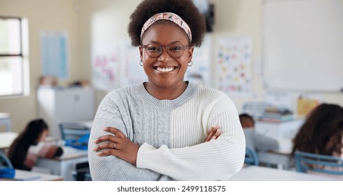 Crossed arms, teacher and portrait of black woman in classroom with confidence in education career. Smile, pride and African female tutor with job in childhood development at school academy. - Powered by Shutterstock