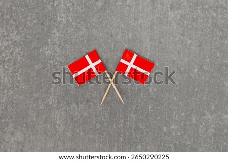 Crossed Denmark Flags on Gray Background
