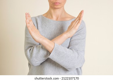 Crossed hands. Break the bias symbol of woman's international day. Woman arms crossed to show solidarity, commitment to calling out bias, breaking stereotypes, inequality, rejecting discrimination