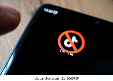 A crossed-out icon on a black smartphone screen. the concept of banning the application tick tok. April 1, 2022. Barnaul. Russia