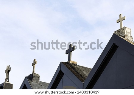 Crosses from a cemetery on the roofs of crypts or burial niches