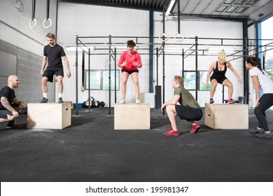 Crossfit Group Trains Box Jump