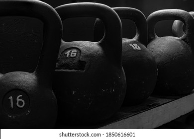 Crossfit Kettlebells Equipment On Dark Background At The Crossfit Gym. Sport Concept