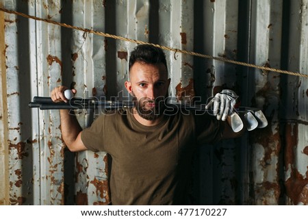 Similar – Image, Stock Photo bearded man huntsman with two axes stands near a rusty train