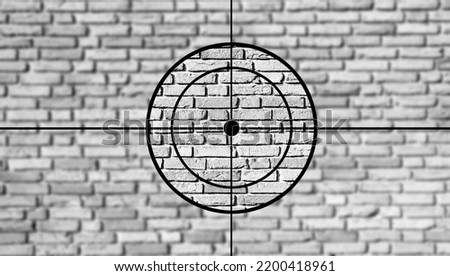 Crosshairs in front of a stone wall