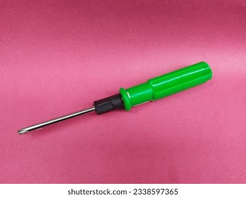 Crosshead screwdriver on red background