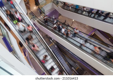 Crossing Escalators With People In Motion Blur