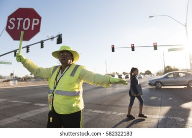 Crossing Guard Patricia Bass Assists A Child In Crossing Lake Mead Boulevard At Tonopah Drive Before Classes At West Preparatory Academy In Las Vegas, Thursday, Oct. 6, 2016.