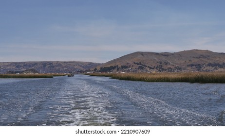 Crossing Lake Titicaca On A Small Boat, In Broad Daylight, With Miles Of Reeds On The Horizon, As Far As The Eye Can See, Path And Navigation