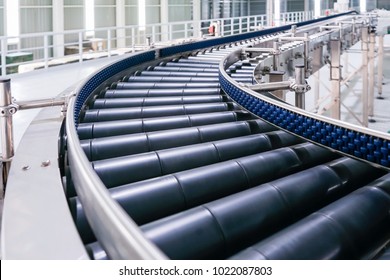 Crossing of the roller conveyor, Production line conveyor roller transportation objects. - Shutterstock ID 1022087803