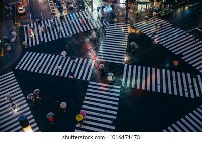 Crossing In Tokyo. Aerial View Of People Crossing The Street