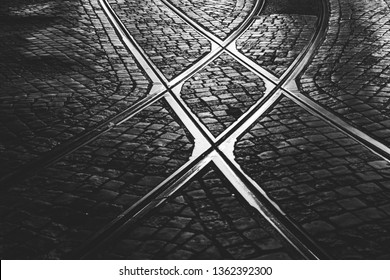 Crossing tram rail on the cobblestone. - Powered by Shutterstock