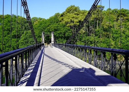 Crossing walkway empty bridge suspended over the river for pedestrians