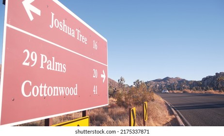 Crossroad sign with direction arrows on road intersection, California USA. Travel destination for trip on vacations. Joshua Tree national park, desert wilderness. Hitchhiking traveling in yucca valley