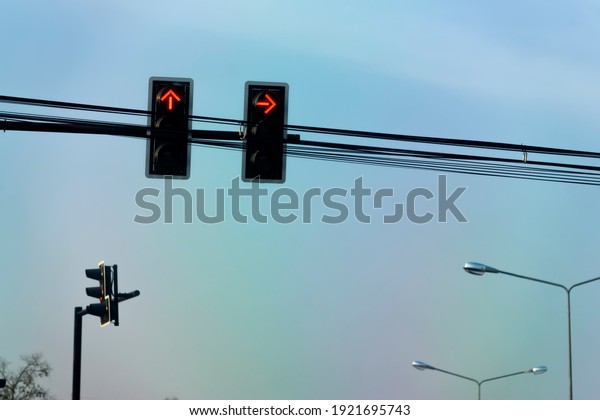 Crossroad traffic lights on the sky background\
in thailand.