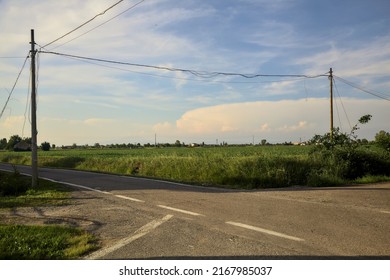 Crossroads In The Countryside At Sunset