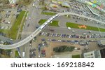 Crossroads of highways and railway with electric train near the telecentre, view from unmanned quadrocopter.