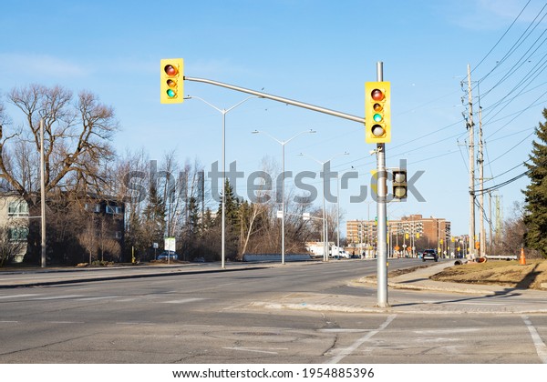 Crossroads with traffic lights in the street of\
Ottawa in Canada