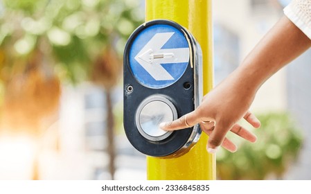 Crosswalk, arrow and button with hand of woman in city for traffic light, intersection and safety. Travel, sign and stop with person at pedestrian crossing in street for press, transport and warning