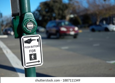 A Crosswalk Button On A Sidewalk