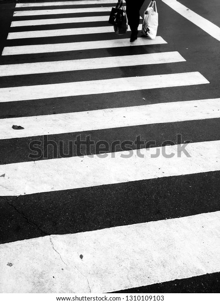 Crosswalk crossing for pedestrian safety. Zebra cross\
walk .