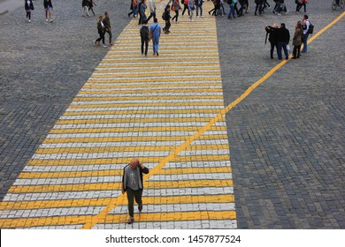 Crosswalk With Crowd Of People Walking Away And One Person Walking Forward In Moscow On June 2019 