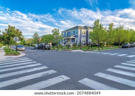 Crosswalk at the intersection road in a residential area at Daybreak, Utah