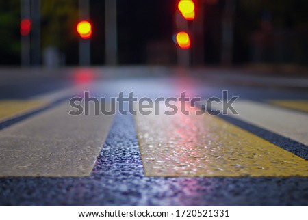 crosswalk at night street, blurred   traffic lights, defocused city background