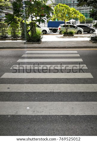 Similar – Road crossing with wide crosswalk in the USA