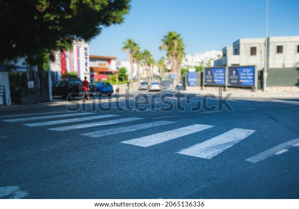 crosswalk on the\
road. crosswalk on the road for safety when people walking cross\
the street. crossing a crosswalk.\
