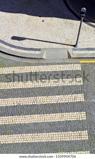 A\
crosswalk seen from above in downtown of Porto. World Heritage City\
by Unesco and one of most visited cities in\
Portugal