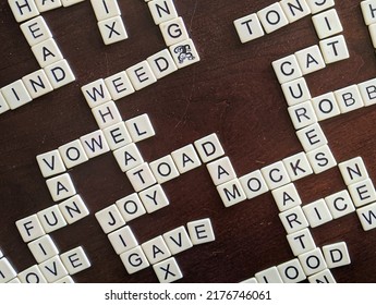 Crossword Game Depicted  On A Dark Wooden Table. Game Night Success. 