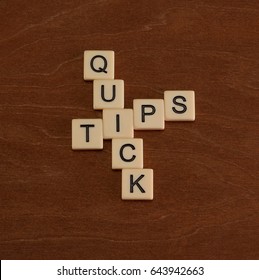 Crossword Puzzle With Words Quick Tips. Travel Guide Concept. Ivory Tiles With Capital Letters On Mahogany Board.