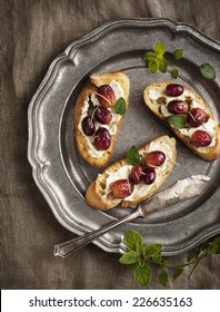 Crostini With Goat Cheese, Grapes And Rosemary.