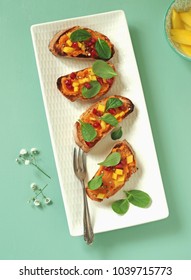 Crostini With Sweet Potato Puree, Mango, Chinese Baby Spinach And Pomegranate