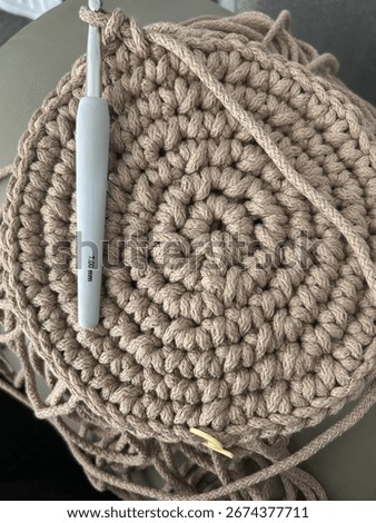 Crotchet pattern in round. Made with macrame yarn and a large crotchet hook